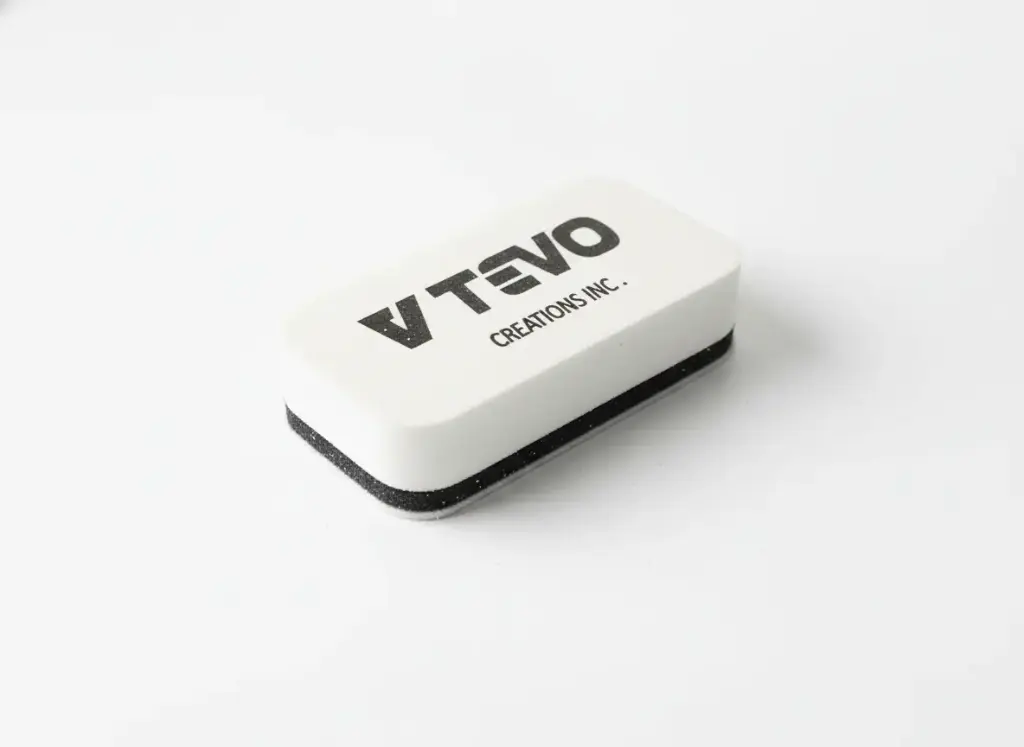 Top angle view of ceramic coating applicator block with V TEVO logo for car detailing.